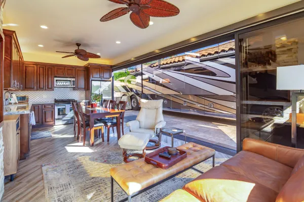 a view of swimming pool with outdoor seating and a patio