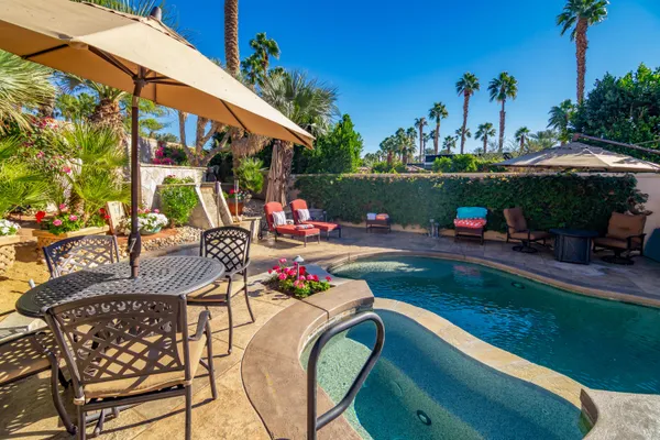 a view of a swimming pool with a patio