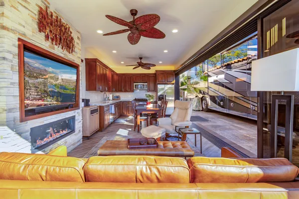 a living room with lots of furniture and a flat screen tv