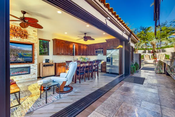 a view of a chairs and table in the patio