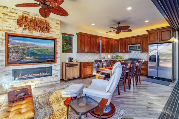 a living room with furniture and kitchen view