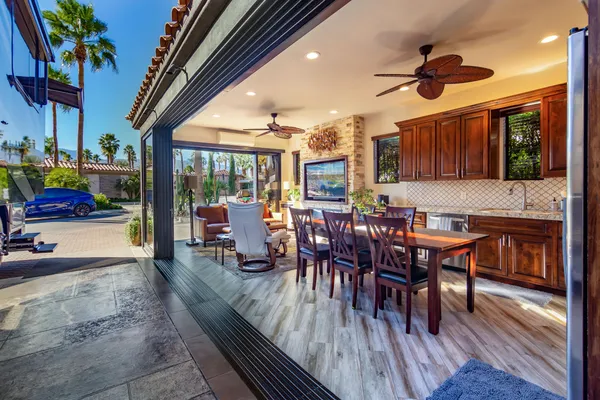a view of a dining room with furniture window and wooden floor