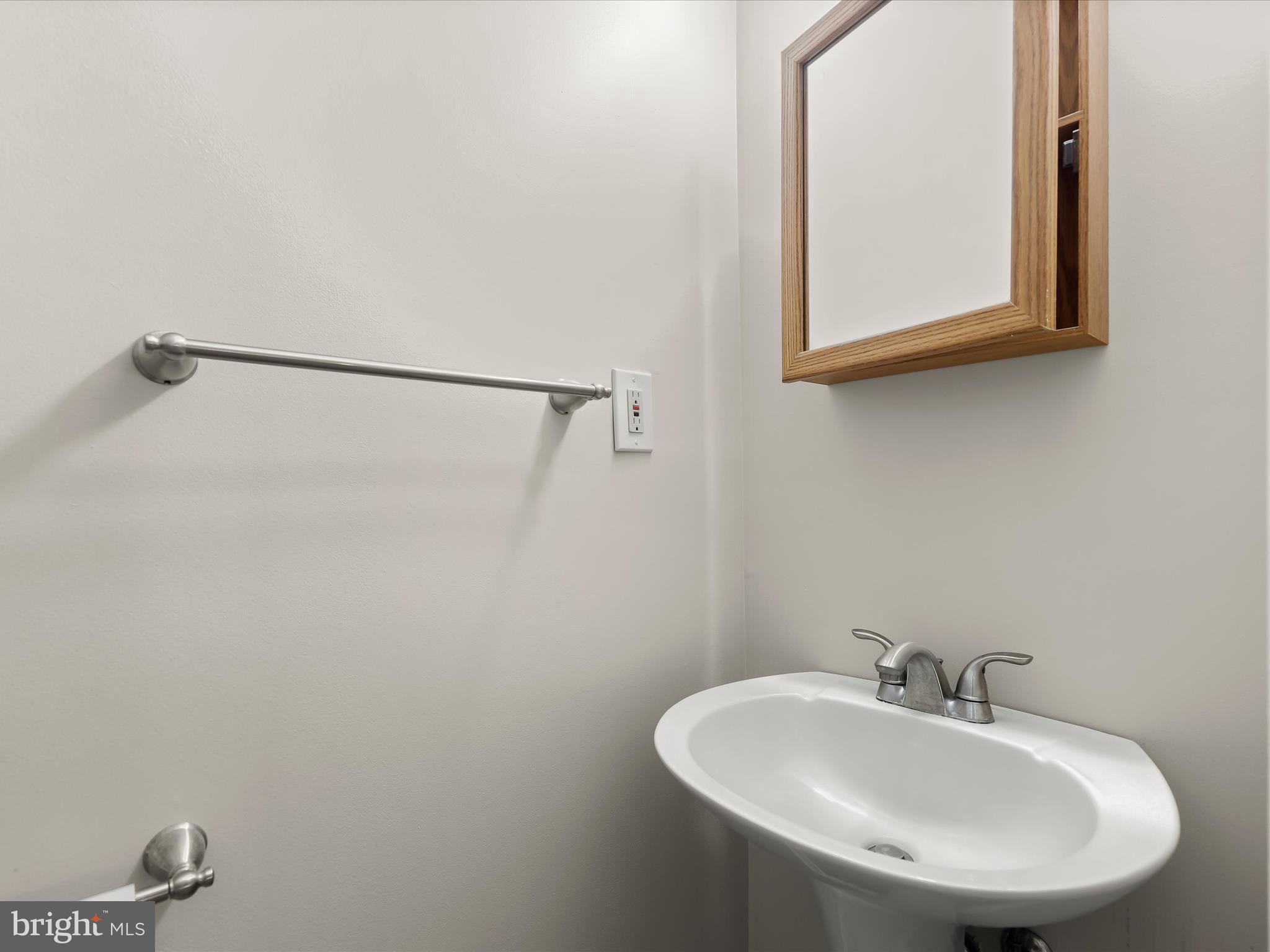 9151 Riverhill Road Laurel, MD 20723 - Photo 14 of 41 a bathroom with a sink and a mirror
