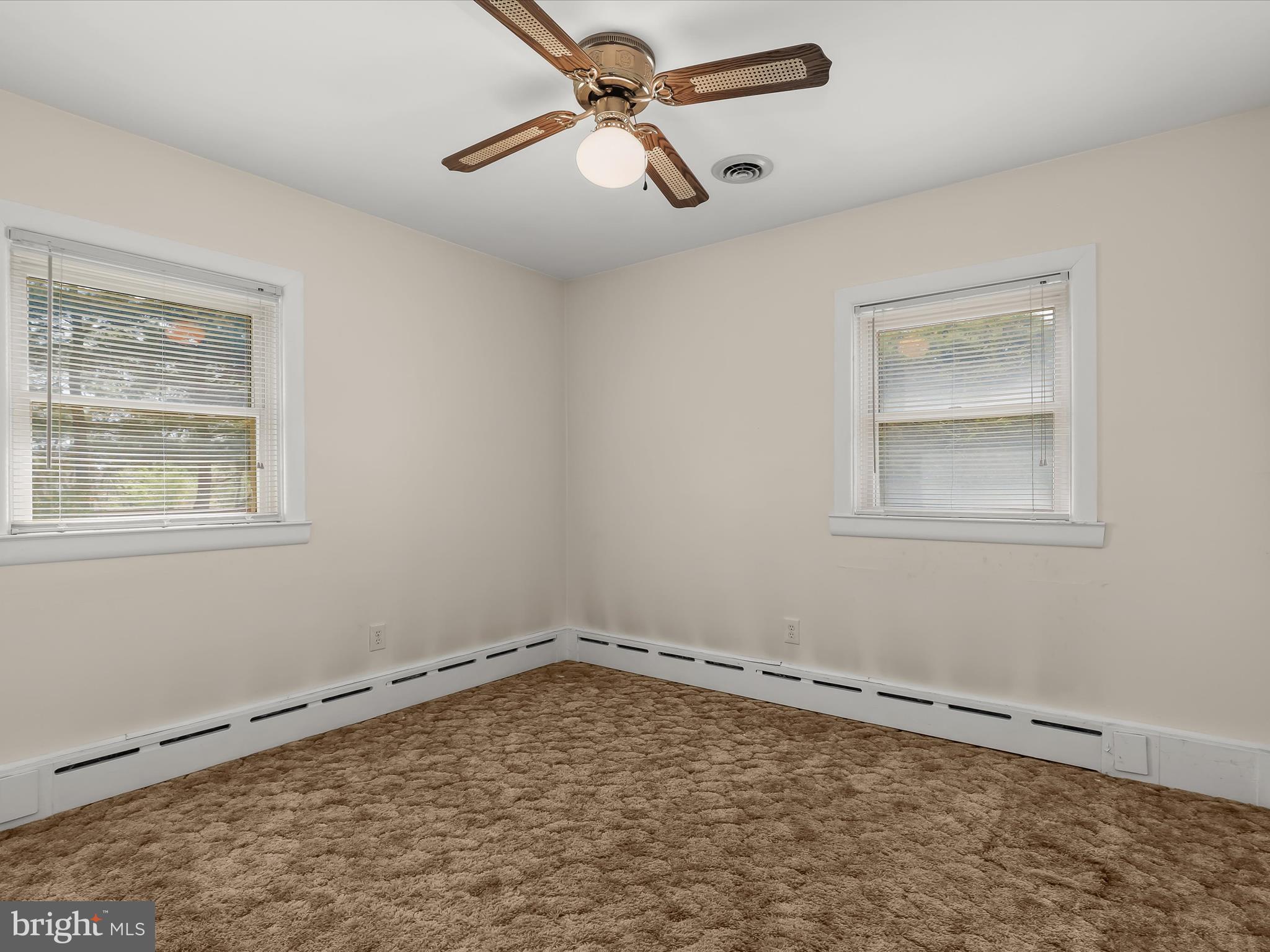 9151 Riverhill Road Laurel, MD 20723 - Photo 16 of 41 a room with a window and ceiling fan