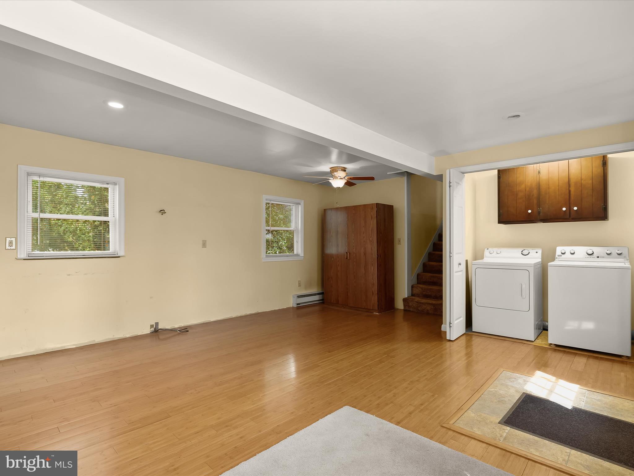 9151 Riverhill Road Laurel, MD 20723 - Photo 19 of 41 a view of a livingroom with furniture and a flat screen tv