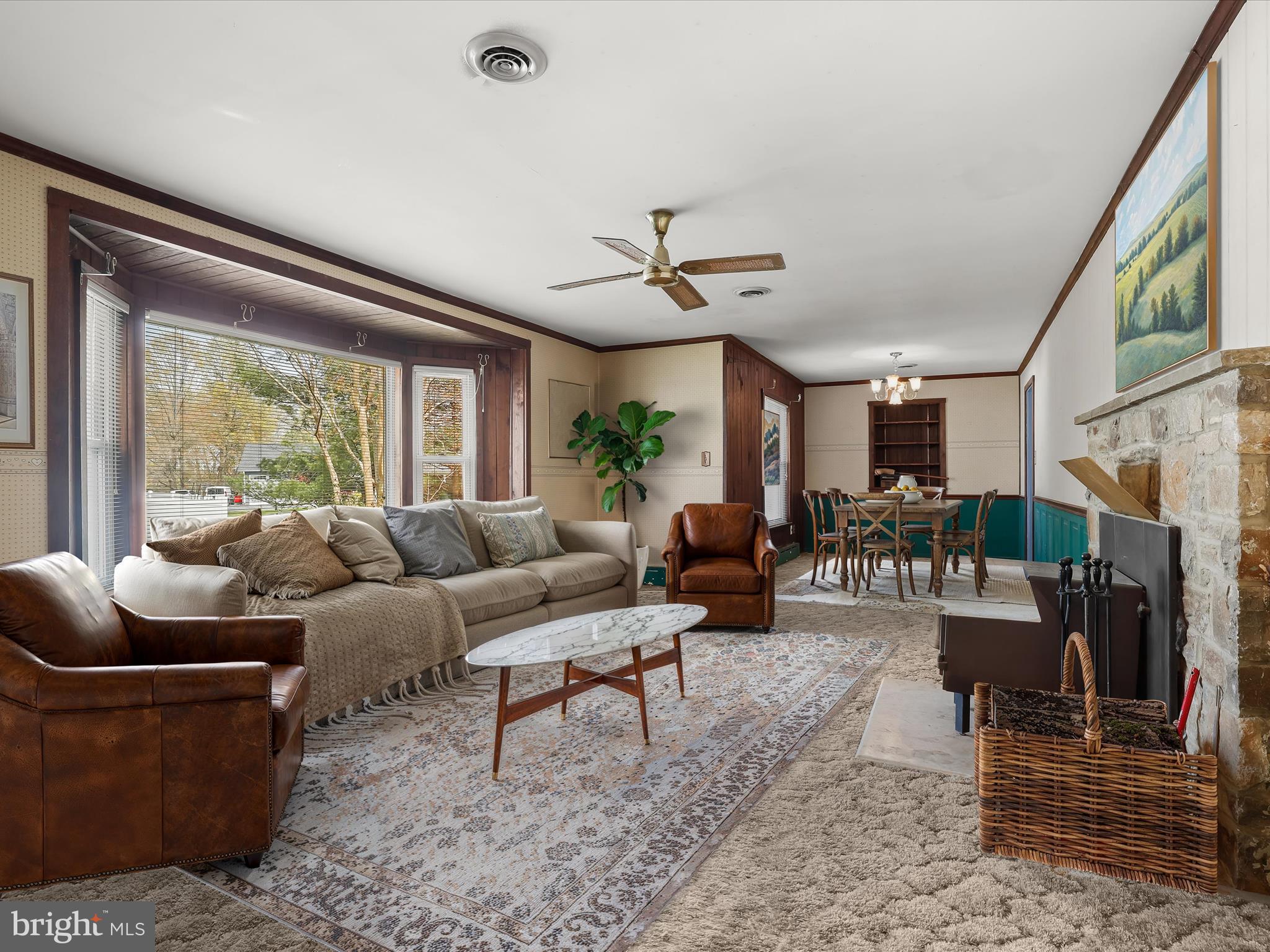 9151 Riverhill Road Laurel, MD 20723 - Photo 2 of 41 a living room with furniture a ceiling fan and a large window
