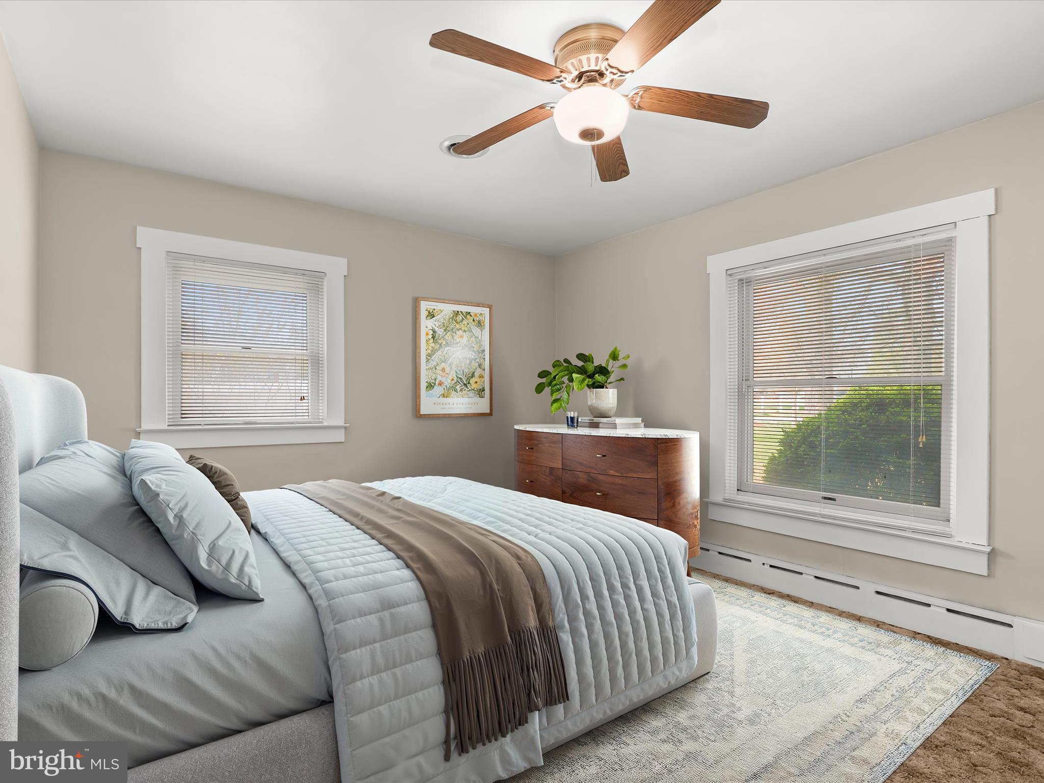 9151 Riverhill Road Laurel, MD 20723 - Photo 3 of 41 a bedroom with a large bed and a window