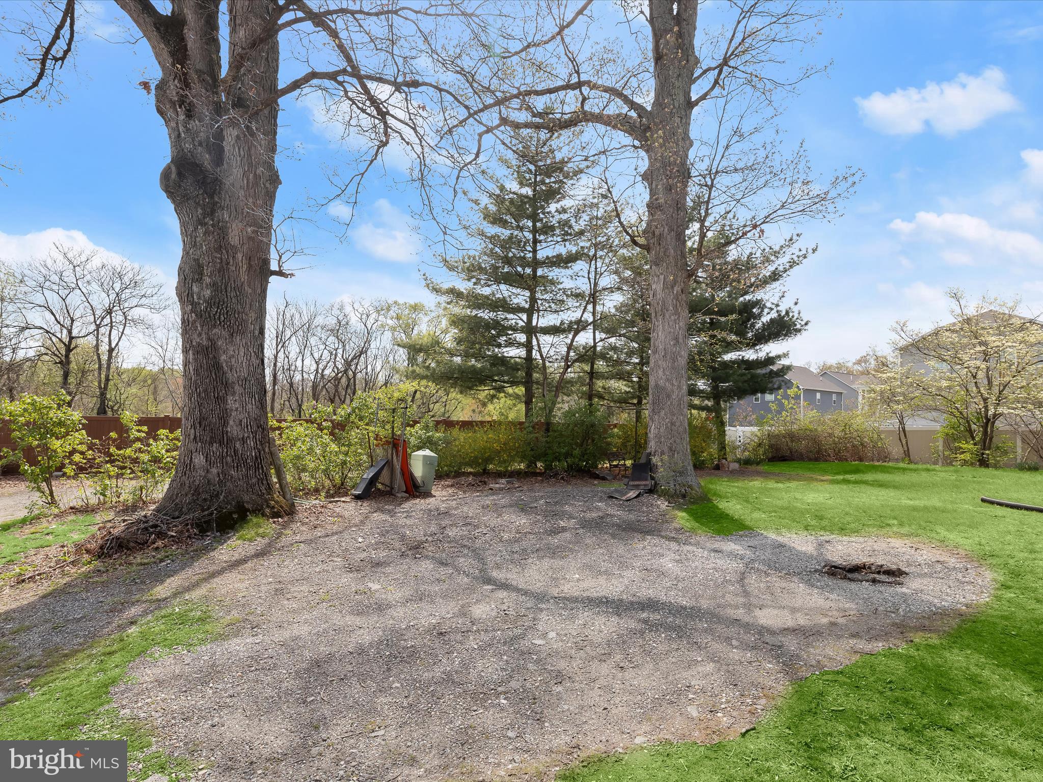9151 Riverhill Road Laurel, MD 20723 - Photo 36 of 41 a view of a yard with a tree in the background