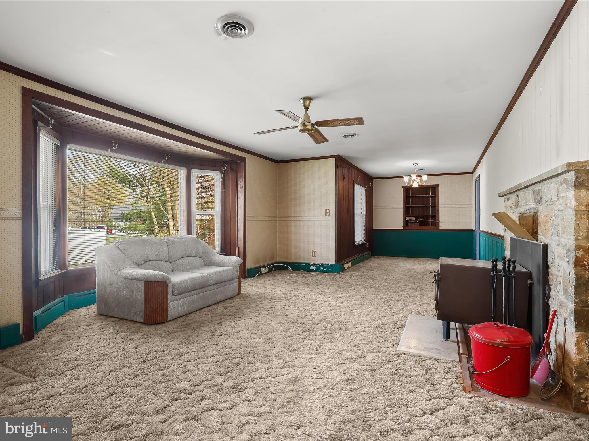 9151 Riverhill Road Laurel, MD 20723 - Photo 7 of 41 a living room with furniture a flat screen tv and a large window