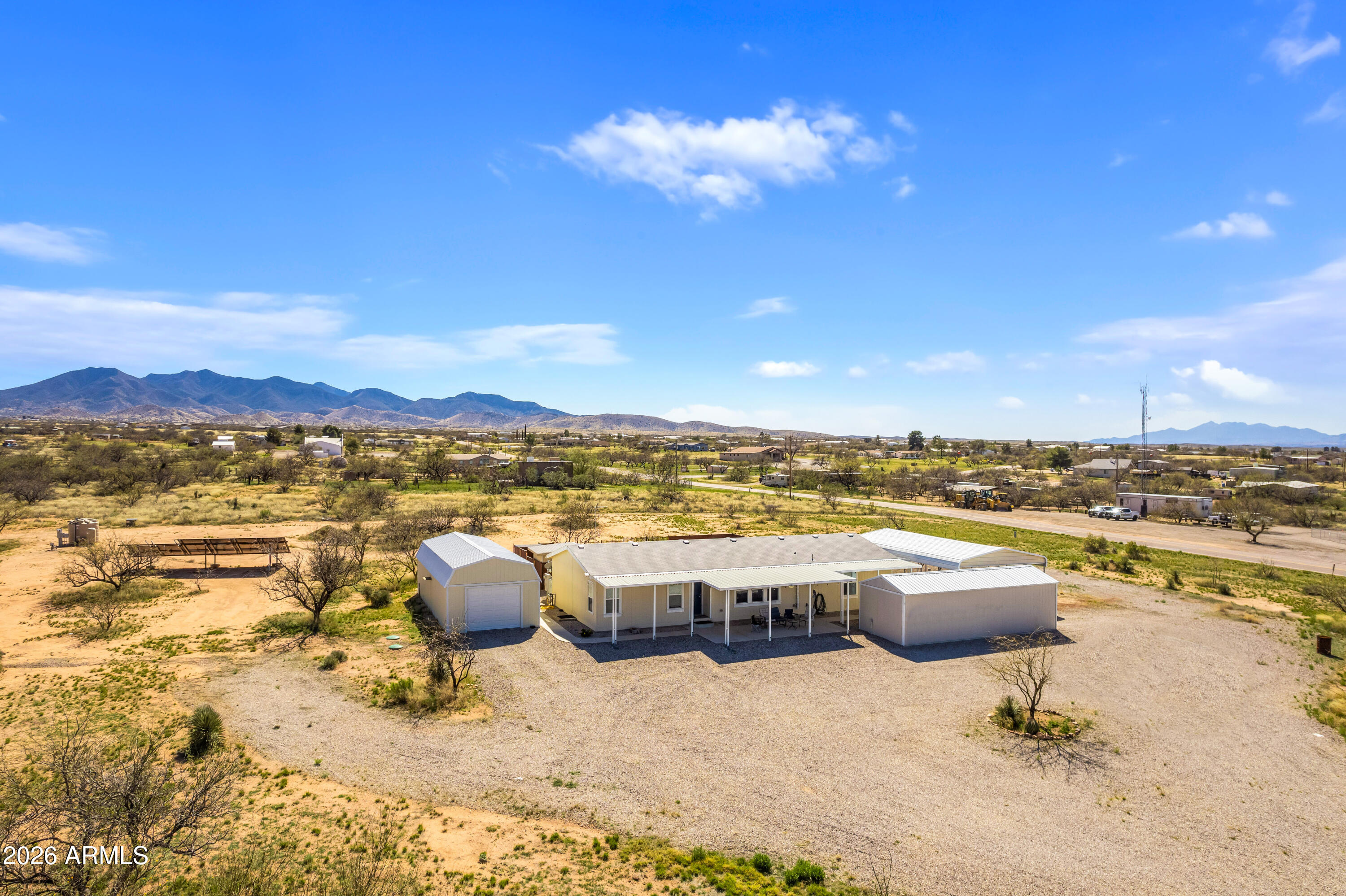 3191 West Williams Road Benson, AZ 85602 - Photo 43 of 46 a view of a terrace with lawn chairs