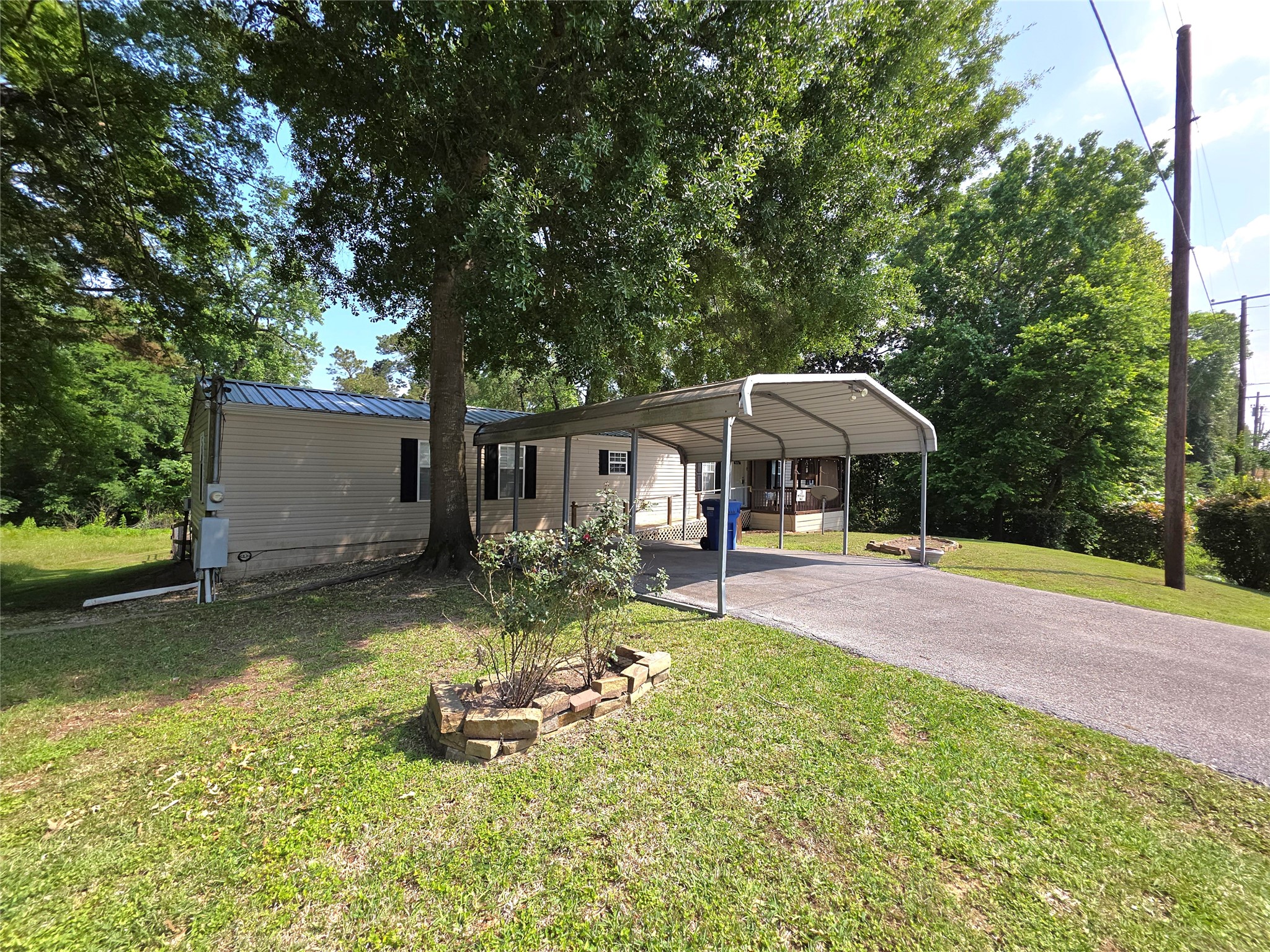 70 Montego Way Point Blank, TX 77364 - Photo 1 of 41 a view of a house with backyard and sitting area