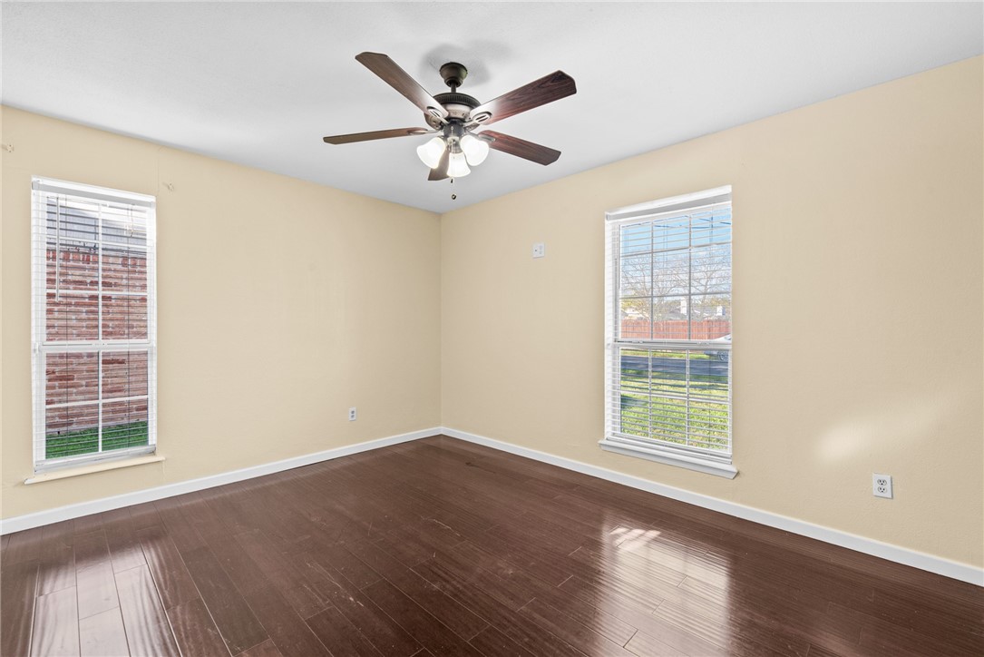 1910 Cherokee Street Corpus Christi, TX 78409 - Photo 13 of 23 a view of a big room with wooden floor and windows