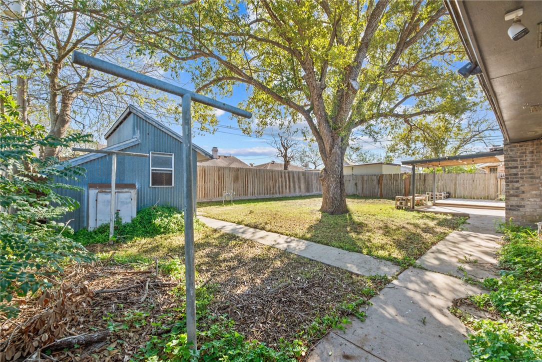 1910 Cherokee Street Corpus Christi, TX 78409 - Photo 19 of 23 a view of a yard in front of a house with large tree