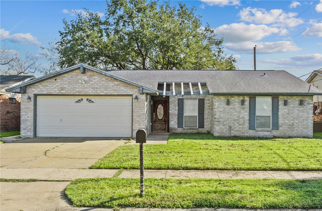 1910 Cherokee Street Corpus Christi, TX 78409 - Photo 23 of 23 a front view of a house with a yard