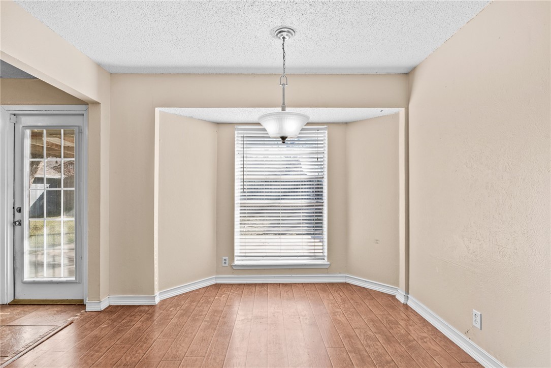 1910 Cherokee Street Corpus Christi, TX 78409 - Photo 5 of 23 a view of empty room with wooden floor and fan