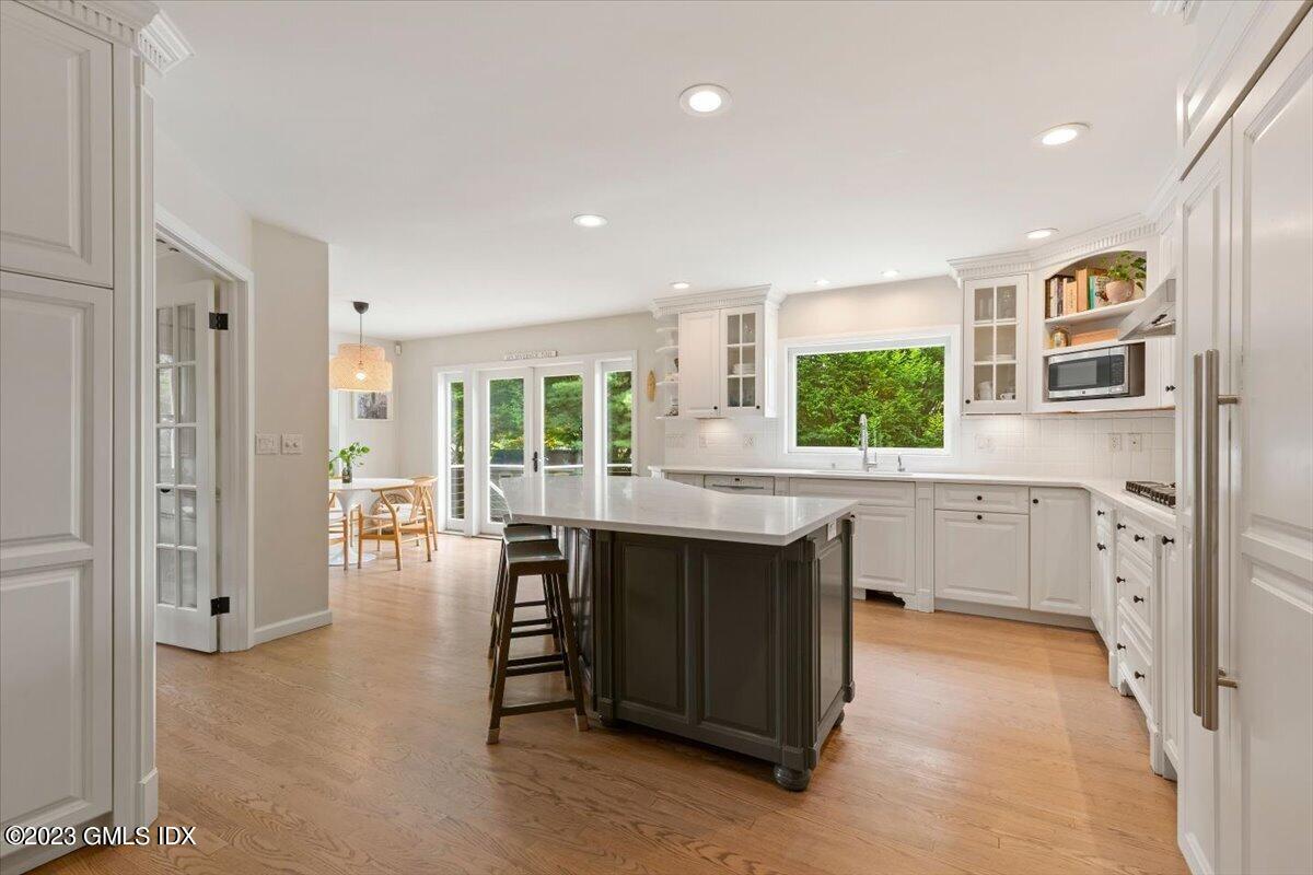 5 Sunshine Avenue Riverside, CT 06878 - Photo 12 of 35 a kitchen with sink cabinets and window