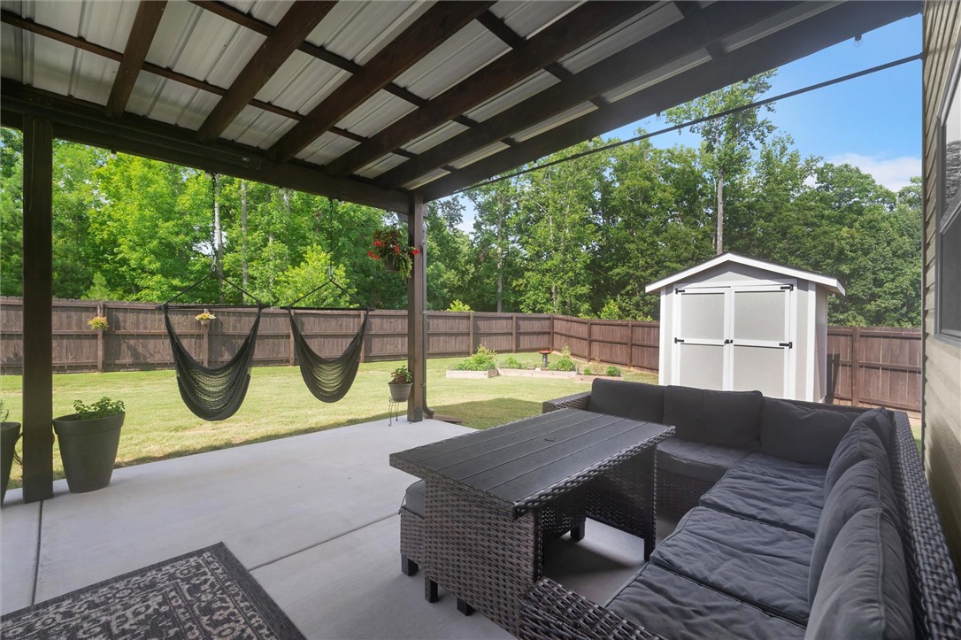 34 Karkinnen Court Pendleton, SC 29670 - Photo 25 of 36 A spacious covered patio provides an inviting outdoor retreat, complete with a private fenced yard.