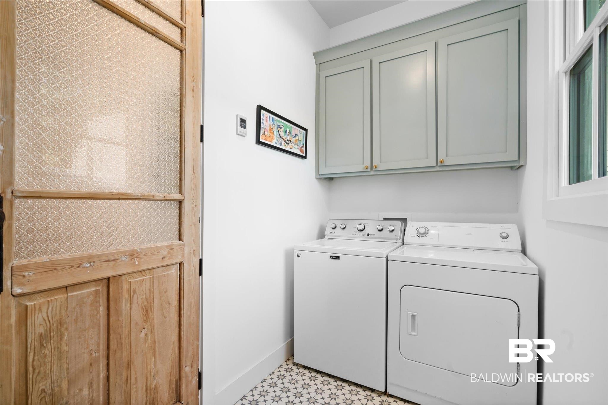 15 Semmes Avenue Mobile, AL 36604 - Photo 15 of 43 Clothes washing area with cabinets and independent washer and dryer