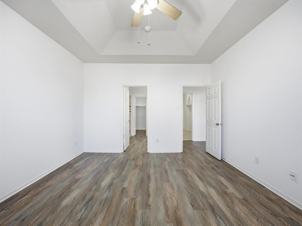 13264 Fencerow Road Fort Worth, TX 76244 - Photo 16 of 26 a view of an empty room with wooden floor