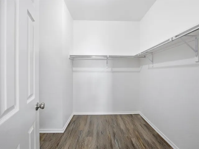 a view of an empty walk in closet
