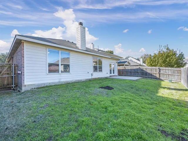 a view of a backyard with a garden