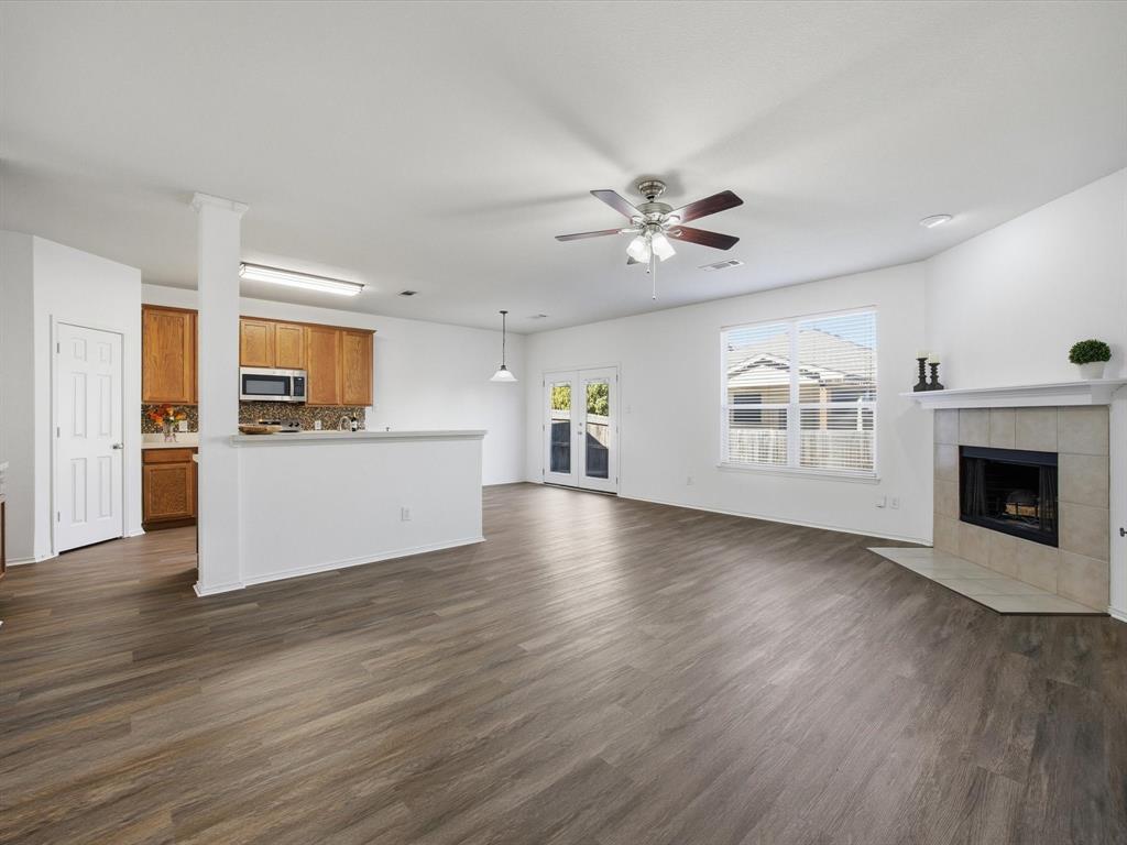 13264 Fencerow Road Fort Worth, TX 76244 - Photo 10 of 26 a view of a kitchen with a sink a kitchen microwave and a stove