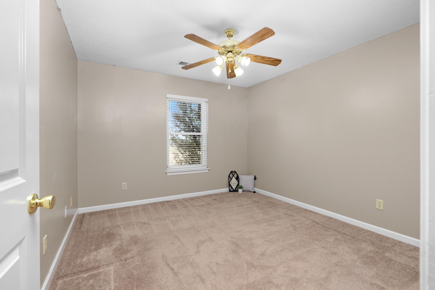 1355 Rosemark Road Atoka, TN 38004 - Photo 26 of 40 Empty room featuring baseboards, carpet floors, and a ceiling fan