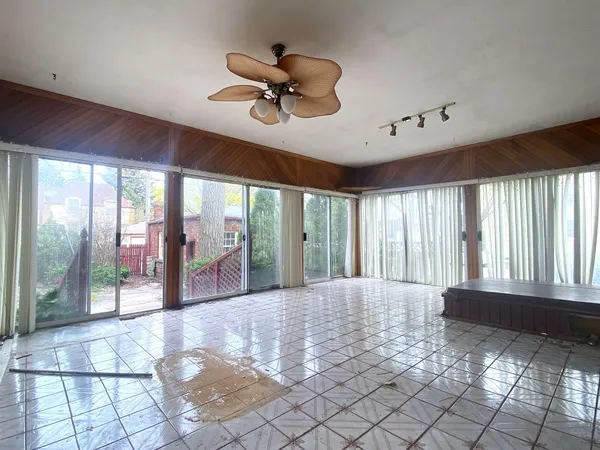 a view of large windows and a swimming pool