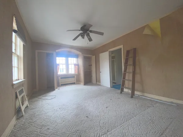 a view of empty room with windows