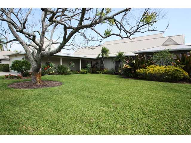 3333 Southeast Fairway East Stuart, FL 34997 - Photo 1 of 14 a view of a house with a yard