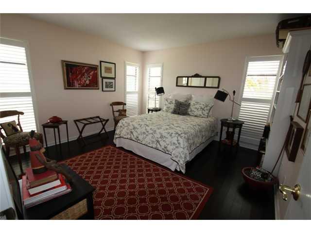 3333 Southeast Fairway East Stuart, FL 34997 - Photo 11 of 14 a bedroom with a bed and a couch