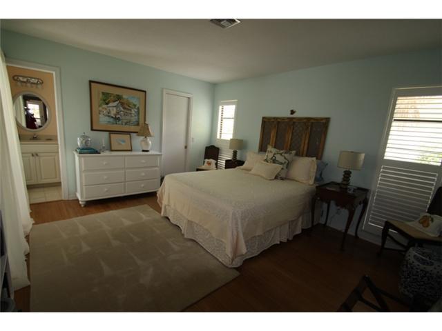 3333 Southeast Fairway East Stuart, FL 34997 - Photo 13 of 14 a bedroom with a bed and a couch