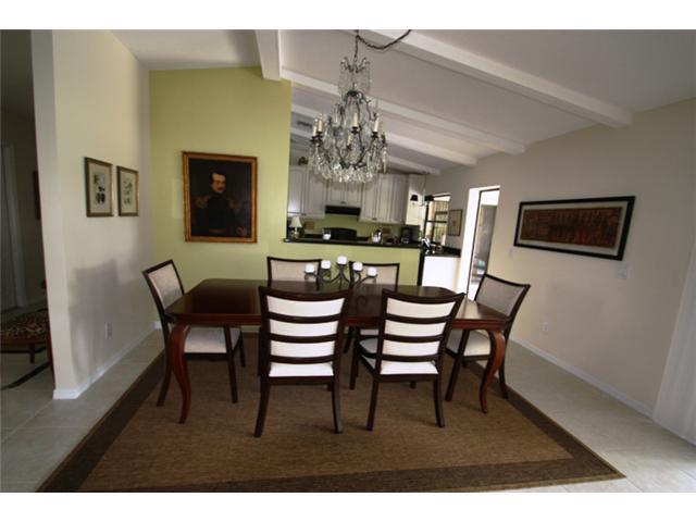 3333 Southeast Fairway East Stuart, FL 34997 - Photo 4 of 14 a view of a dining room with furniture and a chandelier