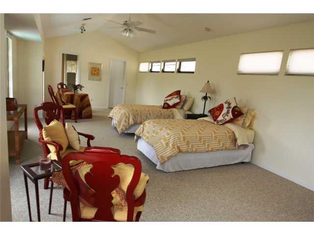 3333 Southeast Fairway East Stuart, FL 34997 - Photo 5 of 14 a bedroom with two beds and a painting