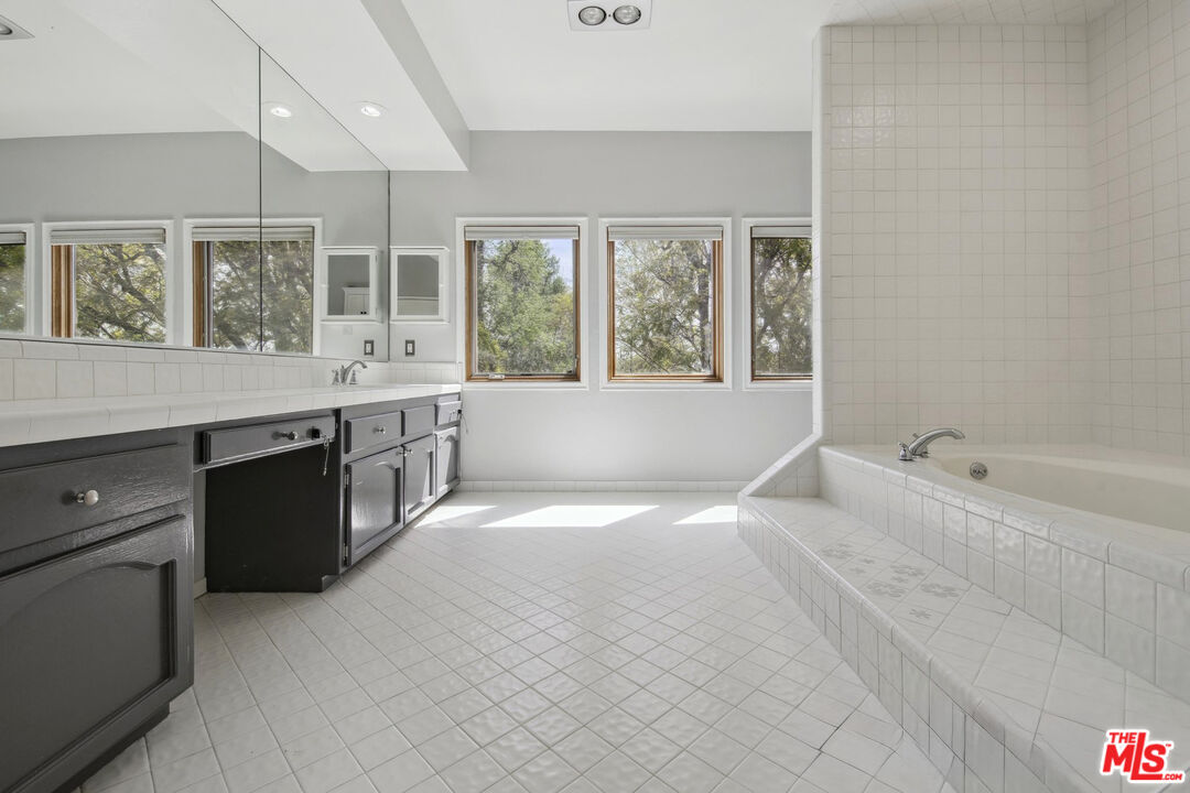 5527 Columbus Avenue Sherman Oaks, CA 91411 - Photo 12 of 29 a large white kitchen with a large window