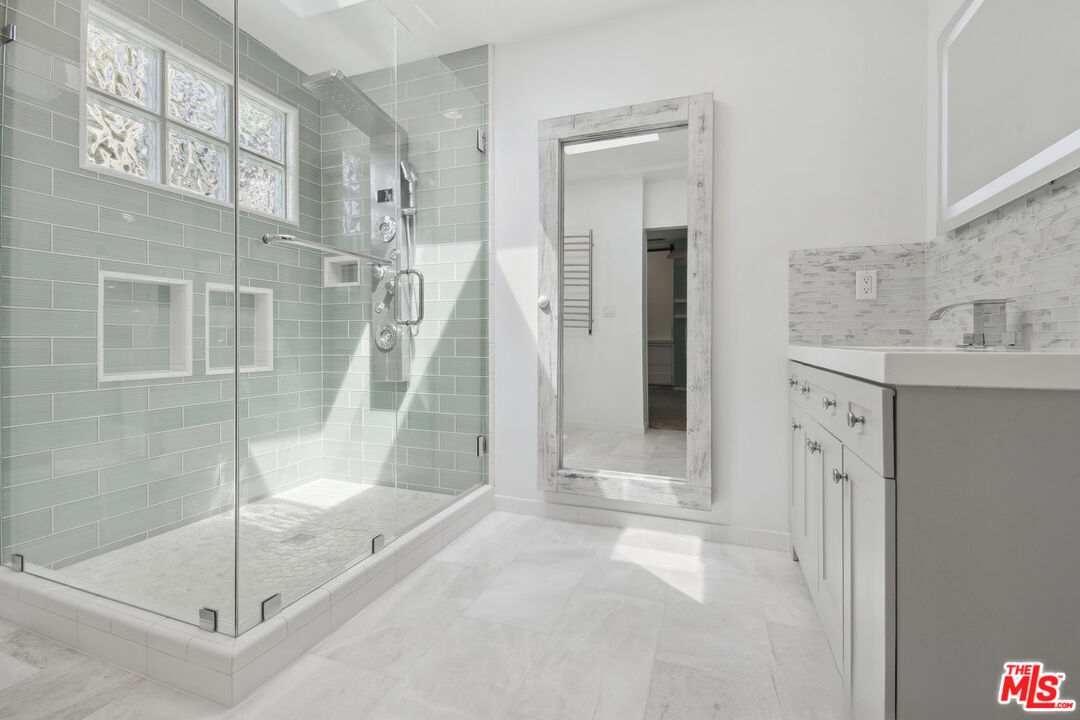5527 Columbus Avenue Sherman Oaks, CA 91411 - Photo 15 of 29 a bathroom with a shower and a sink