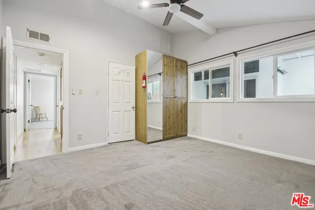 a bathroom with a bathtub sink and mirror