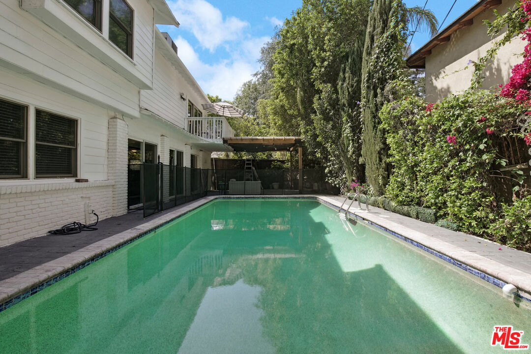 5527 Columbus Avenue Sherman Oaks, CA 91411 - Photo 26 of 29 a view of a house with backyard and sitting area