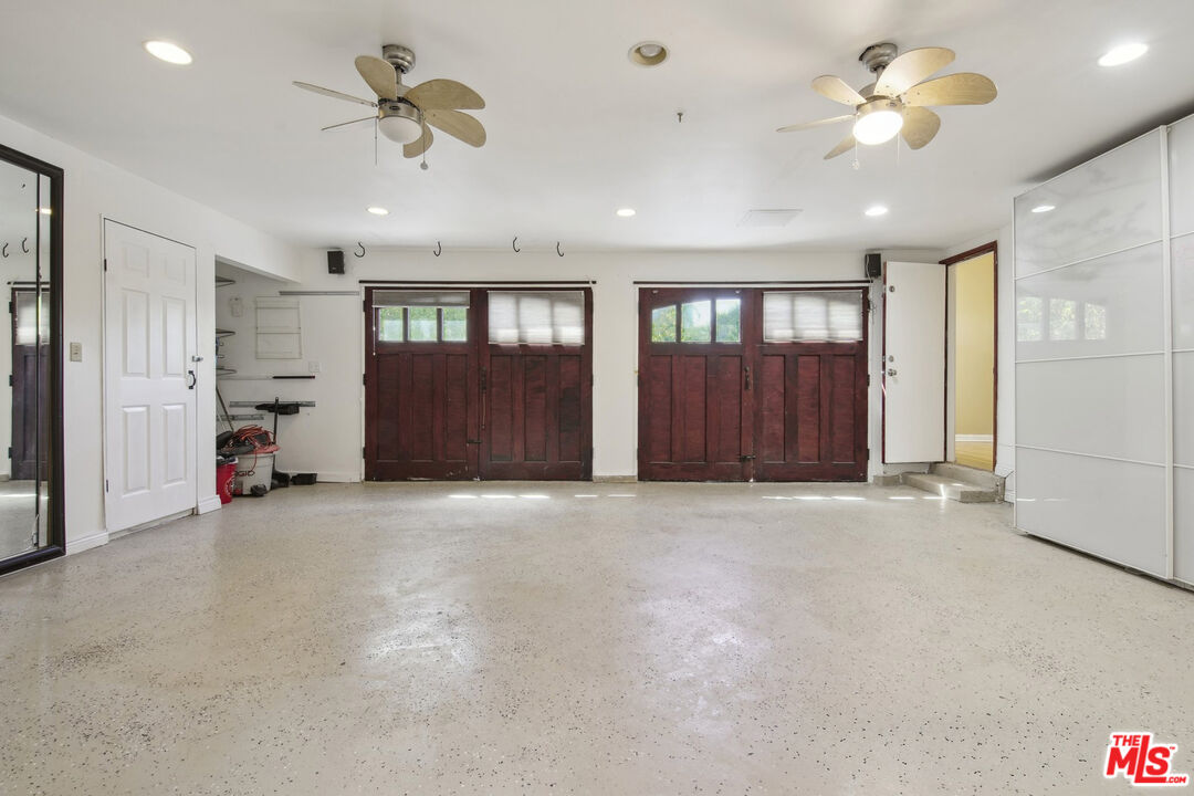 5527 Columbus Avenue Sherman Oaks, CA 91411 - Photo 28 of 29 a view of an empty room with a ceiling fan and window