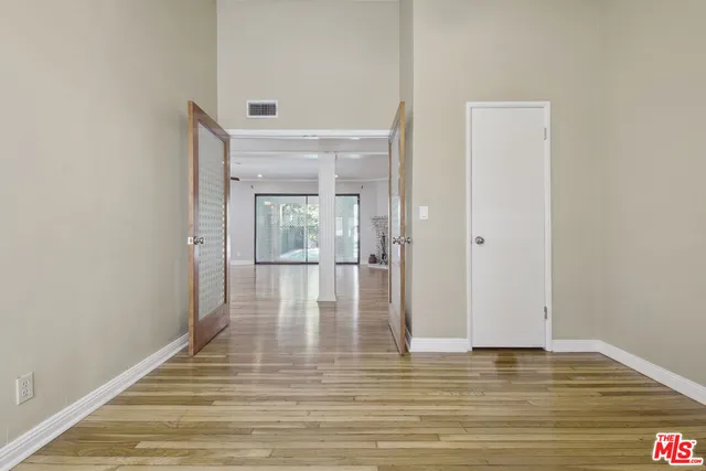 a view of an empty room with a window