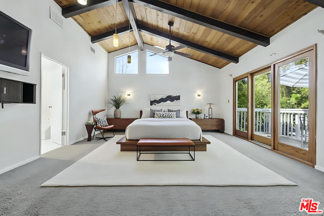 5527 Columbus Avenue Sherman Oaks, CA 91411 - Photo 10 of 29 a spacious bedroom with a bed and a large window