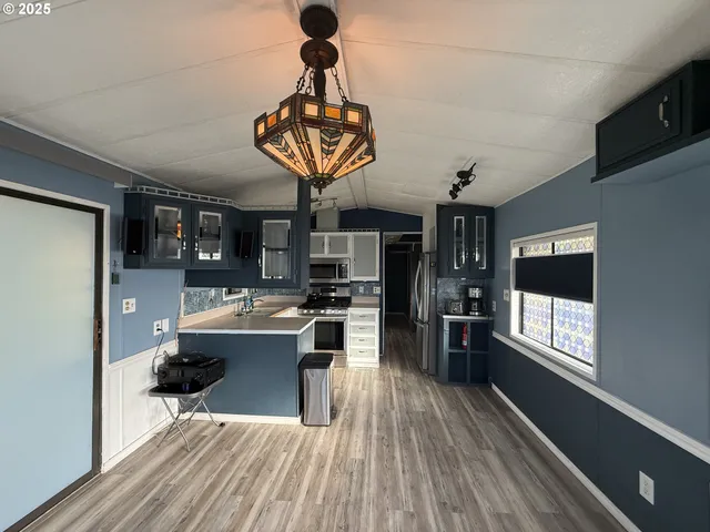 a view of a room with furniture and window