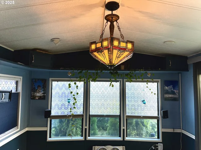 a room with furniture and chandelier