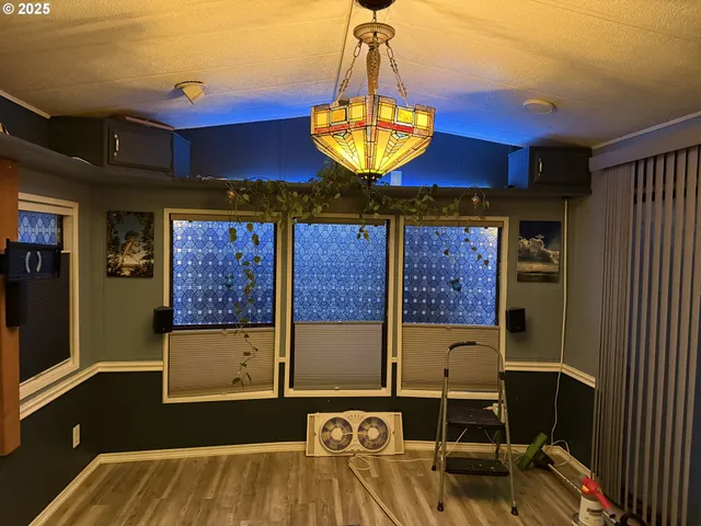 a kitchen with stainless steel appliances granite countertop a refrigerator stove and sink