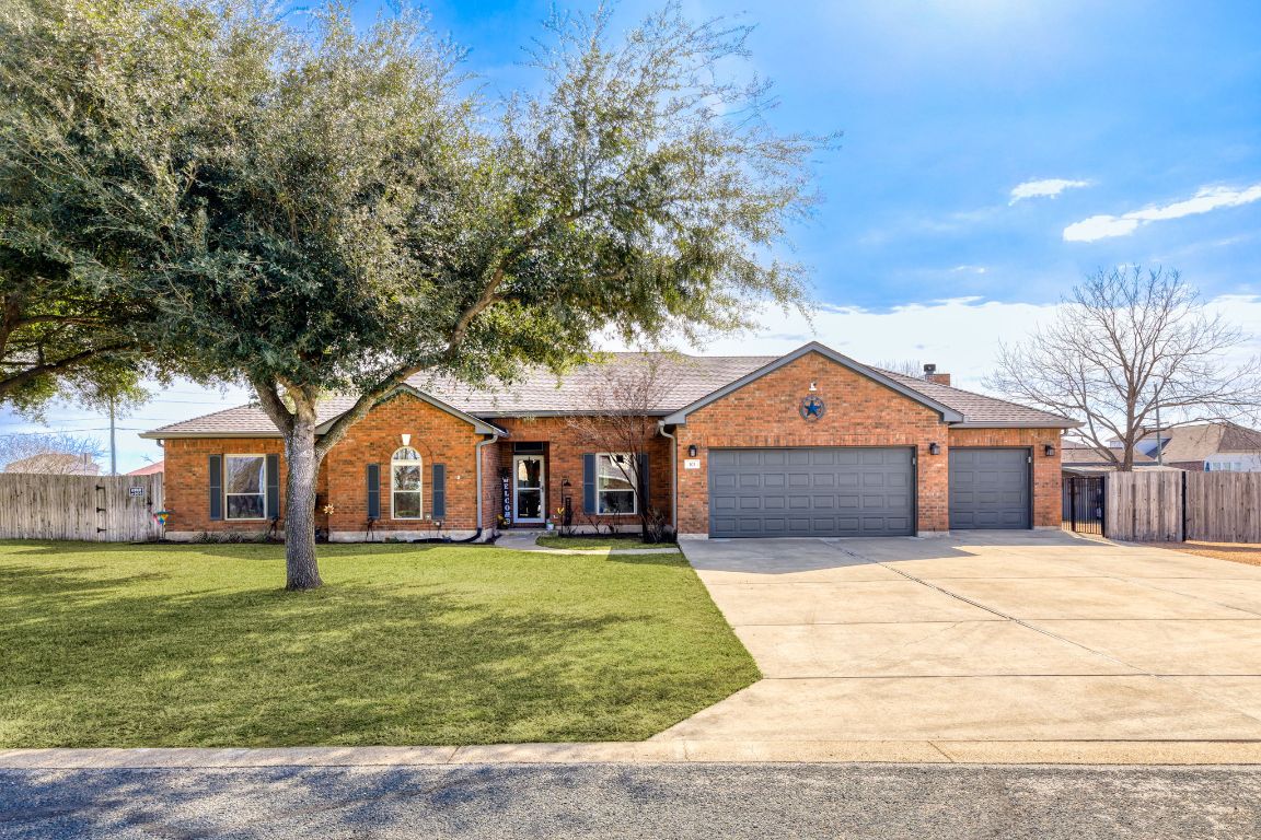 front view of a house with a yard