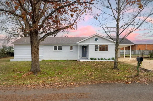 front view of a house with a yard