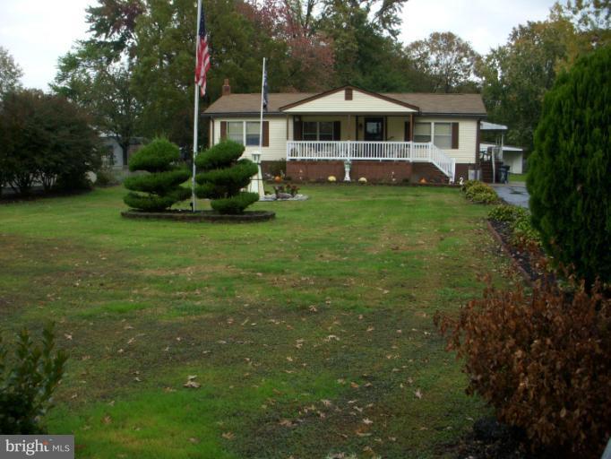 339 Sassafras Road Baltimore, MD 21221 - Photo 1 of 20 a front view of a house with garden
