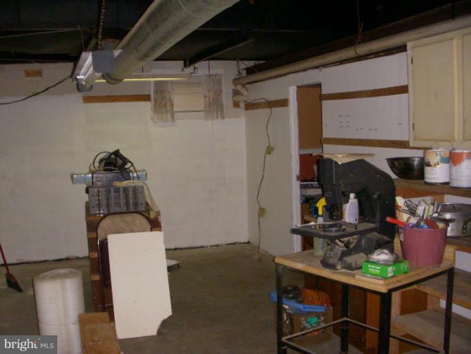 339 Sassafras Road Baltimore, MD 21221 - Photo 11 of 20 a view of storage and utility room with racks on the wall