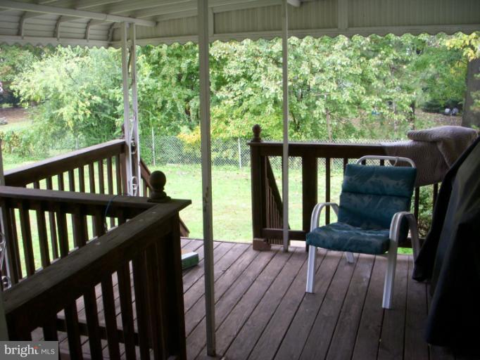 339 Sassafras Road Baltimore, MD 21221 - Photo 14 of 20 a view of a two chairs in the balcony