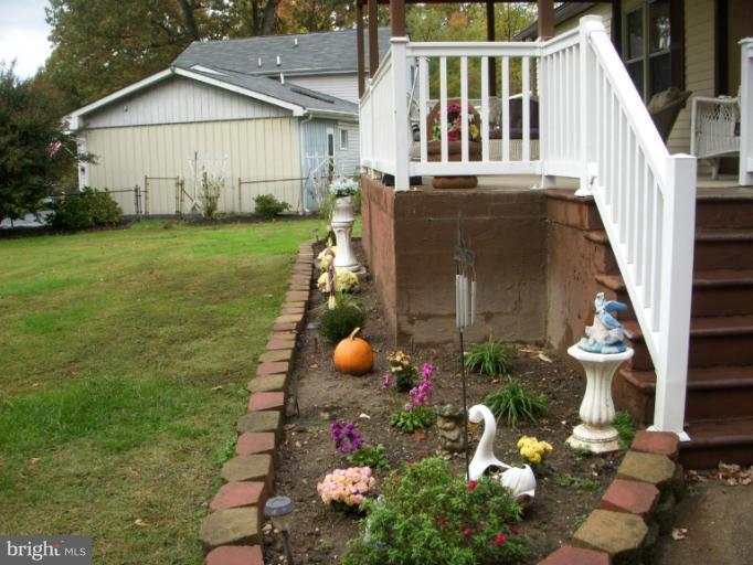 339 Sassafras Road Baltimore, MD 21221 - Photo 18 of 20 a view of a house with backyard and garden